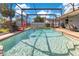 Inviting in-ground pool with screened enclosure and patio area, perfect for relaxation at 5263 Jade Cir, Belle Isle, FL 32812