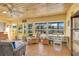 The sunroom has multiple chairs, lots of windows, and tile floors at 5263 Jade Cir, Belle Isle, FL 32812