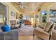 Inviting sunroom with multiple chairs, lots of windows, and tile floors at 5263 Jade Cir, Belle Isle, FL 32812