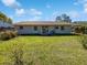 Spacious backyard featuring lush lawn and a patio area at 5618 Carris Ct, Orlando, FL 32810