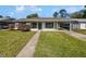 Charming single-story home with a well-maintained lawn and covered parking at 5618 Carris Ct, Orlando, FL 32810