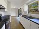 Bright kitchen with stainless steel appliances and a window overlooking the backyard at 5618 Carris Ct, Orlando, FL 32810