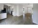 Open-concept home showcasing the kitchen and living area with neutral tile flooring at 5618 Carris Ct, Orlando, FL 32810