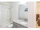 Bright bathroom featuring a shower-tub combo, granite countertop, and a modern faucet at 5694 Aragon Ave, De Leon Springs, FL 32130
