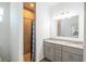 Bathroom featuring double sinks, granite countertops, and a walk-in tiled shower at 5694 Aragon Ave, De Leon Springs, FL 32130