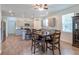 Bright and airy dining area adjacent to kitchen, with an open layout and modern finishes at 5694 Aragon Ave, De Leon Springs, FL 32130