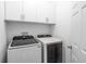 Well-lit laundry room with Samsung washer and dryer at 5694 Aragon Ave, De Leon Springs, FL 32130