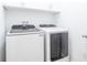 Well-lit laundry room with Samsung washer and dryer at 5694 Aragon Ave, De Leon Springs, FL 32130