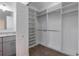 Organized walk-in closet with shelving, hanging rods, and convenient access to the bathroom at 5694 Aragon Ave, De Leon Springs, FL 32130
