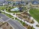 Aerial view of community splash park, playground and outdoor entertaining space at 6525 Rover Way, St Cloud, FL 34771