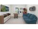 Fun game room with a foosball table, arcade game, comfortable seating, and entertainment system at 6525 Rover Way, St Cloud, FL 34771