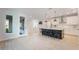 Spacious open-concept kitchen with a large island, sleek countertops, and ample natural light at 6525 Rover Way, St Cloud, FL 34771