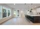 Modern kitchen with a large island, pendant lighting, and stainless steel appliances at 6525 Rover Way, St Cloud, FL 34771