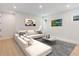 Inviting living room features a comfortable sectional sofa, contemporary artwork, and a stylish coffee table at 6525 Rover Way, St Cloud, FL 34771
