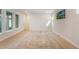 Sunlit living room featuring wood floors, recessed lights, and large windows at 6525 Rover Way, St Cloud, FL 34771