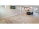 Spacious living room flows into kitchen with island and recessed lighting at 6525 Rover Way, St Cloud, FL 34771