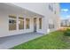 Covered patio with ample space for outdoor seating and entertaining overlooking green backyard at 6525 Rover Way, St Cloud, FL 34771