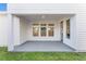 Covered patio with ample space for outdoor seating and entertaining overlooking green backyard at 6525 Rover Way, St Cloud, FL 34771
