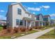A row of modern homes with neat landscaping, creating a pleasant neighborhood scene under a blue sky at 6525 Rover Way, St Cloud, FL 34771
