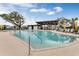 Relaxing swimming pool featuring lounge chairs and umbrellas at 6525 Rover Way, St Cloud, FL 34771