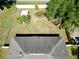 Aerial view showcasing backyard, shed, and perimeter fence at 7 Sequoia Way, Kissimmee, FL 34758