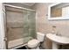 Updated bathroom featuring a glass-enclosed shower and modern fixtures at 7 Sequoia Way, Kissimmee, FL 34758