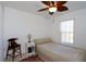 Cozy bedroom with a ceiling fan and a comfortable bed at 7 Sequoia Way, Kissimmee, FL 34758