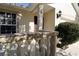 Inviting front porch with decorative railing and accent lighting, enhancing curb appeal and offering a welcoming entrance at 7 Sequoia Way, Kissimmee, FL 34758
