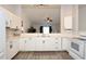 Bright kitchen featuring white cabinetry, modern appliances, and an open layout at 7 Sequoia Way, Kissimmee, FL 34758