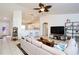 Spacious living room with natural light, tile floors, and modern ceiling fan at 7 Sequoia Way, Kissimmee, FL 34758