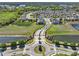 Wide aerial perspective of a Primary-planned community with lakes, green spaces, and tree-lined streets at 7945 Pleasant Pine Cir, Winter Park, FL 32792