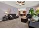 Living room with plush carpet and view to kitchen at 7945 Pleasant Pine Cir, Winter Park, FL 32792