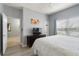 Bright bedroom with wood-look floors, a TV, and a tranquil vibe at 8963 Majesty Palm Rd, Kissimmee, FL 34747