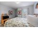 Serene bedroom with artwork and a restful vibe, perfect for unwinding at 8963 Majesty Palm Rd, Kissimmee, FL 34747