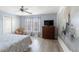 Comfortable bedroom with stylish decor, ample natural light, and a ceiling fan at 8963 Majesty Palm Rd, Kissimmee, FL 34747