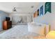 Inviting bedroom with a statement wall, modern furnishings, and a comfortable bed at 8963 Majesty Palm Rd, Kissimmee, FL 34747