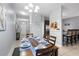 Formal dining room with seating for six, view of the entryway, and bar seating at 8963 Majesty Palm Rd, Kissimmee, FL 34747