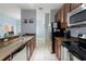 Fully equipped kitchen with stainless steel appliances and granite countertops at 8963 Majesty Palm Rd, Kissimmee, FL 34747