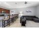 Open-concept living area with breakfast bar, perfect for casual dining and relaxation at 8963 Majesty Palm Rd, Kissimmee, FL 34747