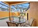 Enclosed pool area with lounge chairs surrounded by a screen enclosure and palm trees at 8963 Majesty Palm Rd, Kissimmee, FL 34747