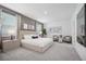 Spacious primary bedroom with a decorative accent wall, plush carpet, and windows with natural light at 912 Pearlwood Loop, Eagle Lake, FL 33839