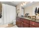 Bathroom features a double sink vanity, tiled flooring, and shower, offering a functional space with modern upgrades at 101 S Eola Dr # 902, Orlando, FL 32801