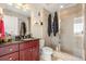 Stylish bathroom features a vanity with a sink, tiled shower, and essential storage, offering a functional retreat at 101 S Eola Dr # 902, Orlando, FL 32801