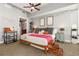 Stylish bedroom boasts high ceilings, cozy decor, and an adjacent bathroom, creating a comfortable personal space at 101 S Eola Dr # 902, Orlando, FL 32801