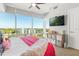 Bright bedroom showcases a large window with city views and media center, blending comfort with modern amenities at 101 S Eola Dr # 902, Orlando, FL 32801