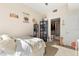Bright bedroom has a large window, custom bookcase, and access to an adjacent bathroom, creating a functional retreat at 101 S Eola Dr # 902, Orlando, FL 32801
