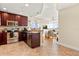 Open concept kitchen with dark wood cabinets and modern stainless steel appliances at 101 S Eola Dr # 902, Orlando, FL 32801