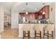 Spacious kitchen with ample counter space, dark wood cabinets, and bar seating at 101 S Eola Dr # 902, Orlando, FL 32801