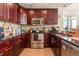 Stylish kitchen with dark countertops, stainless steel appliances, and efficient design at 101 S Eola Dr # 902, Orlando, FL 32801