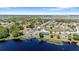 Waterfront community featuring multiple single Gathering homes and lake access at 130 Islabella Way, Groveland, FL 34736